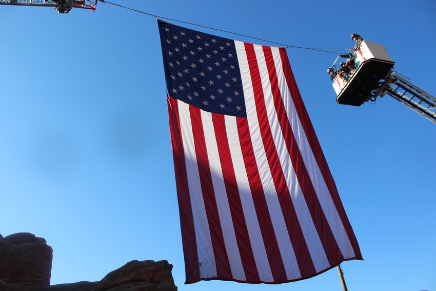 The American flag hangs high over 2,500 firefighters and residents at the Colorado Memorial Stair Climb.